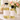 Two bottles of oil on a surface with a blurred floral arrangement in the background